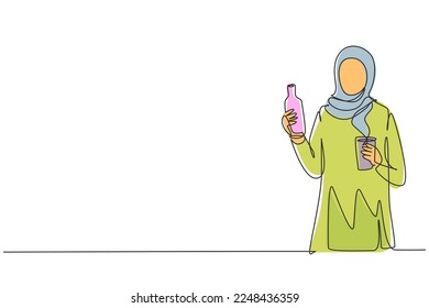 Continuous one line drawing young Arabian woman holding bottle in one hand and glass of orange juice in the other while having breakfast at home. Single line draw design vector graphic illustration