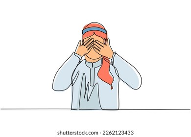 Continuous one line drawing young Arabian man closes his eyes with his hands because of disgust and reluctance to see something, fear or sadness isolated. Single line draw design vector illustration