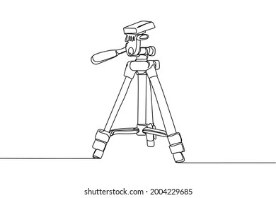 Continuous one line of tripod video concept in silhouette on a white background. Linear stylized.Minimalist.