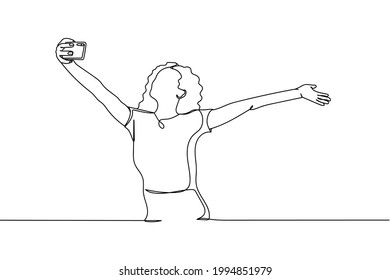 Continuous one line of woman taking a selfie with smartphone in silhouette on a white background. Linear stylized.Minimalist.