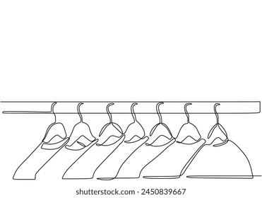 Continuous one single line of Clothes on a hanger in the store hangers