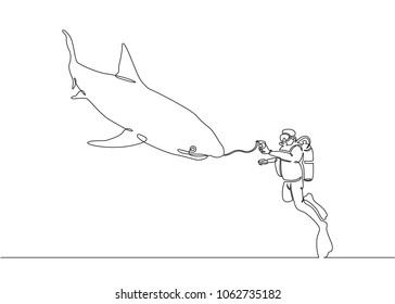 Continuous single drawn one line of a scuba diver with a camera and a shark under the water