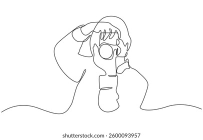 Continuous single line drawing of woman with DSLR camera taking pictures, The girl takes pictures with the camera one line is continuous vector illustration.