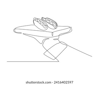 Continuous single line sketch drawing of waitress hand holding tray with hot dog sausage mustard bread meat. One line art of delicious meal fast food restaurant serving vector illustration