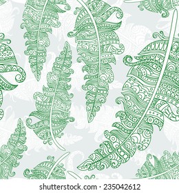 Contour feathers are hand-drawn. Vector illustration. Seamless background of feathers decorated with a pattern.