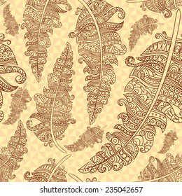 Contour feathers are hand-drawn. Vector illustration. Seamless background of feathers decorated with a pattern.