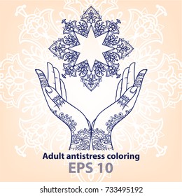 Contour image of a star and female hands. Design for coloring. Elegant hands hold a star.