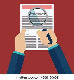 Contract inspection concept - Hand holding magnifying glass over a contract