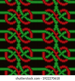 Contrast ornate seamless knitted vector pattern as a fabric texture in green, red and black colors