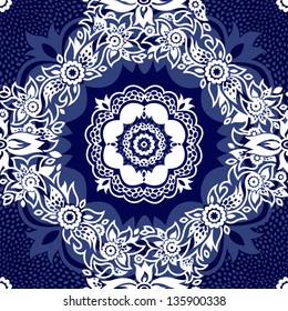 Contrasting seamless pattern with flowers and curls.
