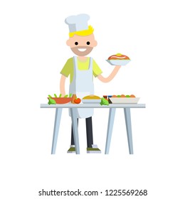 Cook in a white cap and apron preparing food. The chef in the restaurant with a table with a bunch of plates and dishes. The man in the kitchen.
