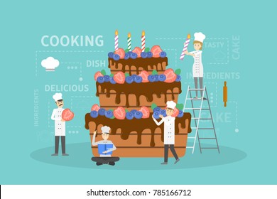 Cooking big cake. Chefs in uniform decorating cake.