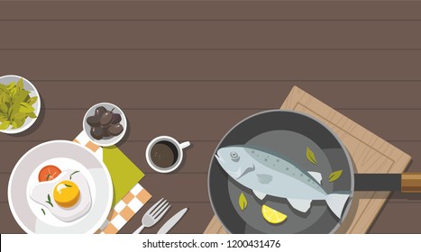 Cooking consept. Fried egg, Vegetables with spinach, Frying Pan and fish. Top view