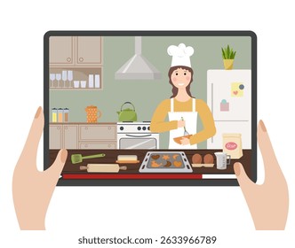Cooking courses online. Chef gives a step-by-step lesson. Hands holding a tablet with an online show. View of a kitchen with a chef and baking ingredients. Cooking at home, time with family, home