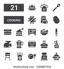 cooking icon set. Collection of 21 filled cooking icons included Cupcake, Toaster, Dinner, Apron, Barbecue, Oil bottle, Pie, Ribs, Blender, Meat grinder, Knife, Salad, Microwave