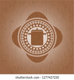 cooking pot icon inside badge with wooden background