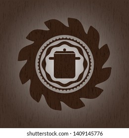 cooking pot icon inside badge with wood background
