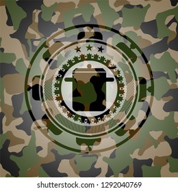cooking pot icon inside camouflage emblem