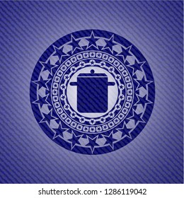 cooking pot icon inside denim background