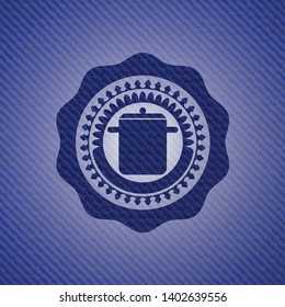 cooking pot icon inside emblem with denim texture