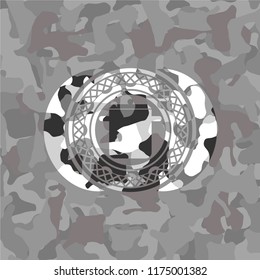 cooking pot icon inside grey camouflage texture
