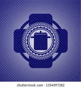 cooking pot icon inside jean or denim emblem or badge background