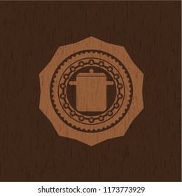 cooking pot icon inside realistic wooden emblem