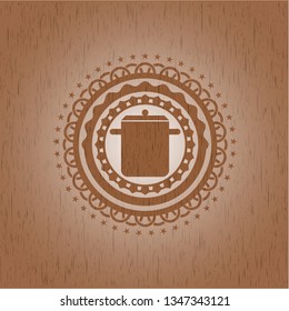 cooking pot icon inside retro wood emblem
