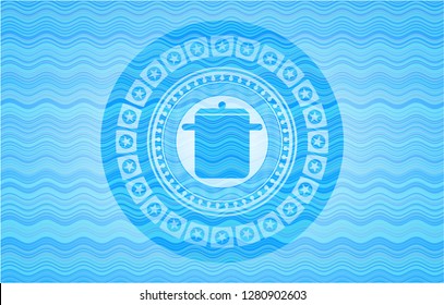 cooking pot icon inside water style emblem.