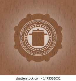 cooking pot icon inside wood emblem. Retro