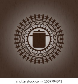 cooking pot icon inside wood emblem