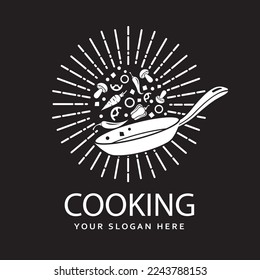 cooking process of vegetables on pan isolated with rays on black background