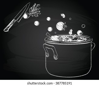 Cooking soup with vegetables on the chalkboard background