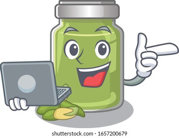 Cool character of pistachio butter working with laptop