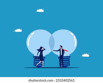 Cooperation. Business people negotiate cooperate under two light bulbs