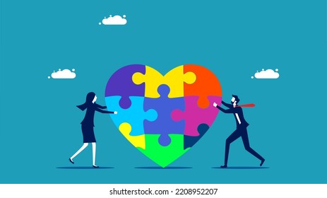 cooperation. Businessmen helping to assemble a heart jigsaw puzzle