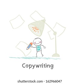 copywriter writes in pencil on paper under a huge lamp
