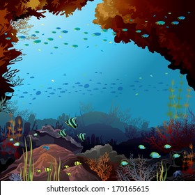 Coral reef with school of fish and underwater creatures in a blue sea.