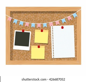 Cork board with a piece of paper in the cage for paper records, photo frames and garland of flags