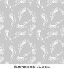 Cornflower vector seamless pattern. Hand drawn doodle ink floral textile fabric print. Field knapweed flowers on grey background.
