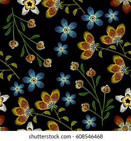 Cornflowers embroidery seamless pattern. Beautiful spring flowers on black background. Classical embroidery fashionable template for design of clothes 