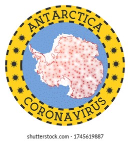Coronavirus in Antarctica sign. Round badge with shape of Antarctica. Yellow country lockdown emblem with title and virus signs. Vector illustration.