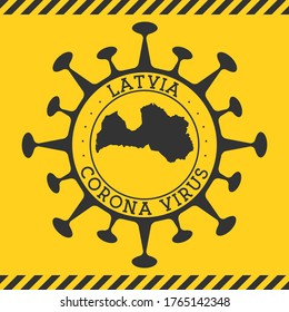 Coronavirus in Latvia sign. Round badge with shape of virus and Latvia map. Yellow country epidemic lockdown stamp. Vector illustration.