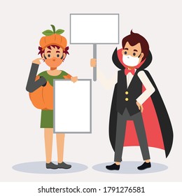 Coronavirus prevention, covid-19 and social distancing with happy halloween, Wear medical mask protect from covid-19. Boys holding blank sign.