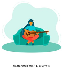 Coronavirus Quarantine, people work at home, live, play and listen to music. I m sitting at home. A girl is resting at home with a guitar during quarantine. Education and study at home. Hobby.