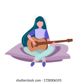 Coronavirus Quarantine, people work at home, live, play and listen to music. A girl is resting at home with a guitar during quarantine. Education and study at home. Hobby.