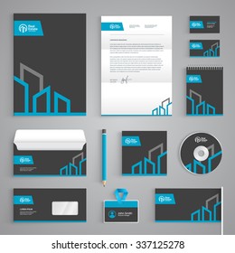 Corporate identity branding template. Real Estate vector stationery design with building logo icon on dark gray background. Business documentation