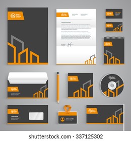 Corporate identity branding template. Real Estate vector stationery design with building logo icon on dark gray background. Business documentation