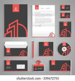 Corporate identity branding template. Real Estate vector stationery design with building logo icon on dark gray background. Business documentation