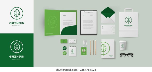 Corporate identity template in green colors with minimal style leaf logo for branding eco market, clinic, cosmetology salon or wellness company. Folder and business cards, bag and envelope mockup set